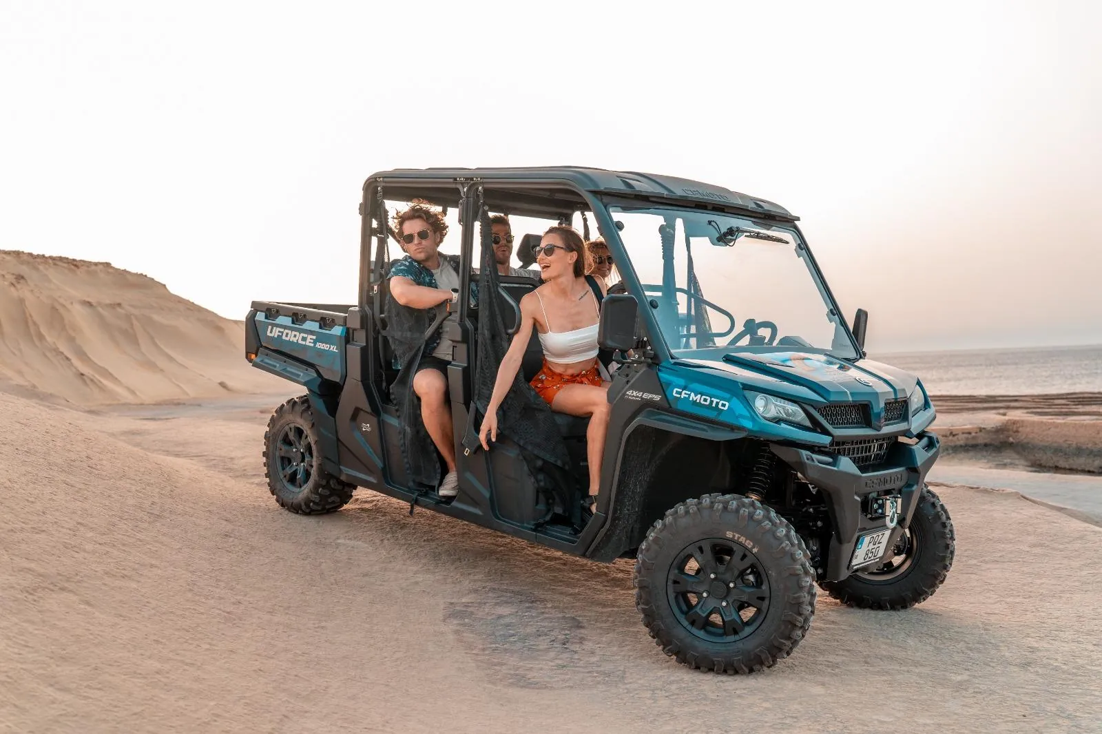 Guests in an open private buggy on the clifftop above the Gozo coast